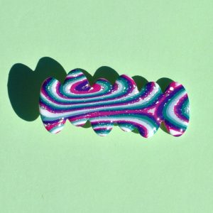 Barrette irrégulière avec 6 pointes asymétriques, au motif "à la dérive des astres".