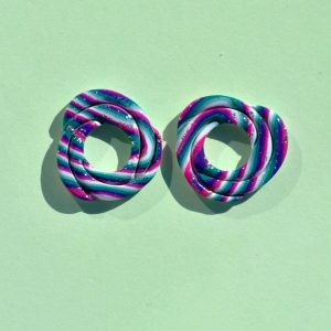 Pampilles interchangeables de "grande" taille en forme de cercle irrégulier composé de trois cercles entrelacés, motif "à la dérive des astres".